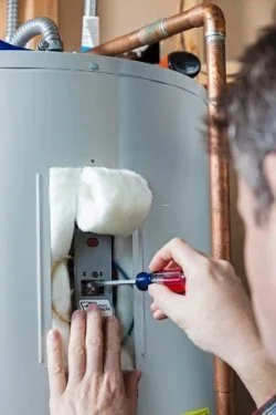 Curtis Plumbing repairing a water heater in Riverview, FL.